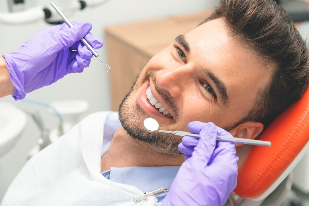 Handsome,Young,Man,In,Stomatology,Clinic.,Dental,Care Dental Insurance in Brooklyn